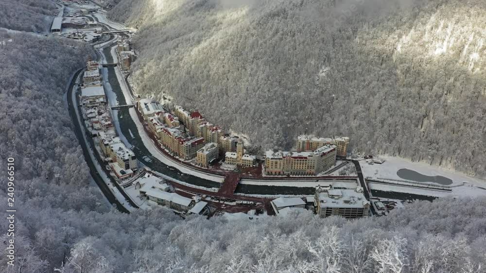 Sochi, Russia, 11-01-2018.Rosa Khutor ski resort, Sochi, Krasnaya Polyana. Winter forest, nature of the Caucasus, hotel on the banks of the river Mzymta. Aerial photography with quadcopter