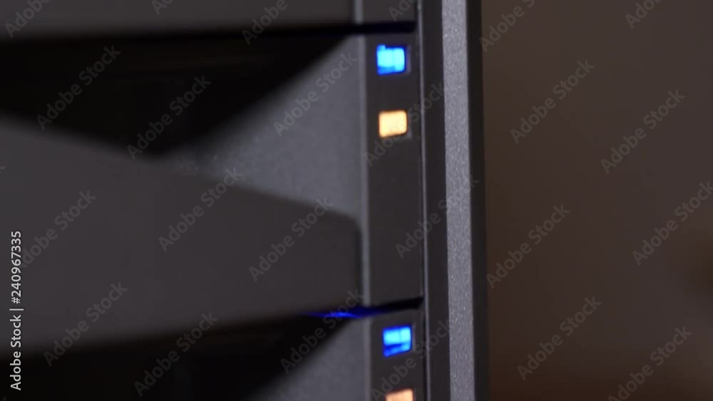 Blinking LED lights showing activity on hard drive RAID system. Stock