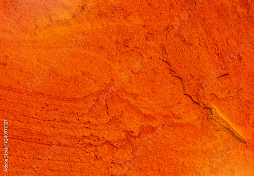 natural texture of a cracked red ocher wall