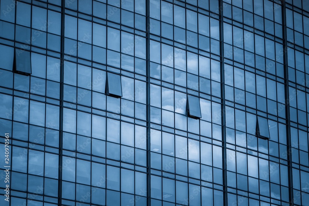Clouds Reflected in Windows of Modern Office Building. Clouds Reflected in Windows of Modern Office Building.