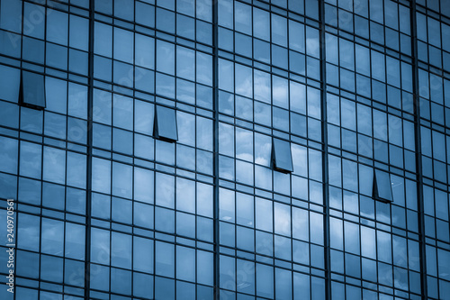 Clouds Reflected in Windows of Modern Office Building.