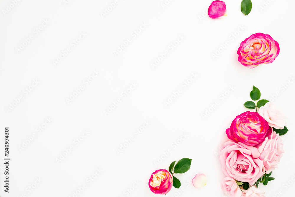 Floral frame with pink flowers and leaves on white background. Flat lay, top view. Floral frame with pink flowers and leaves on white background. Flat lay, top view.