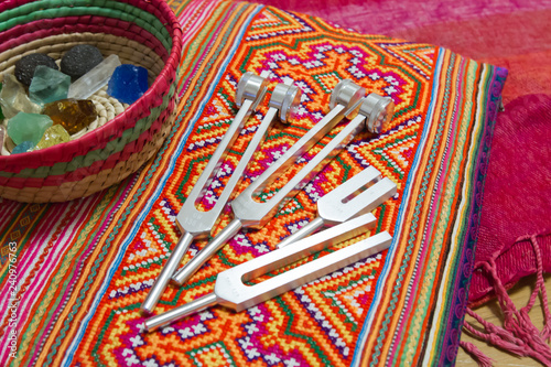 Hand holding a tuning fork .