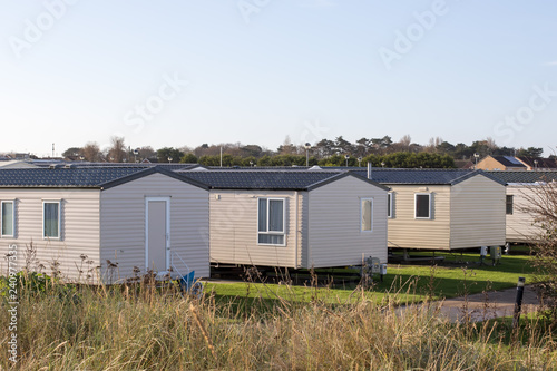 Modern beach holiday homes. A row of seaside vacation lodges © Ian Dyball