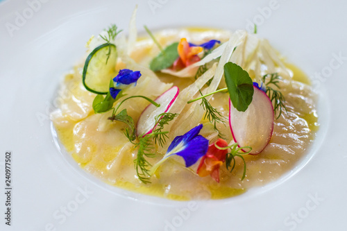 raw fish ceviche with edible flowers