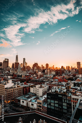 New York City Skyline, rooftop view, sunset, blue cloudy sky