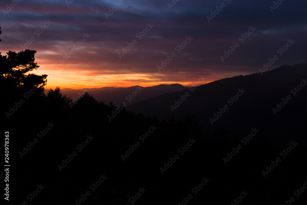 Stunning sunset between mountains Stunning sunset between mountains