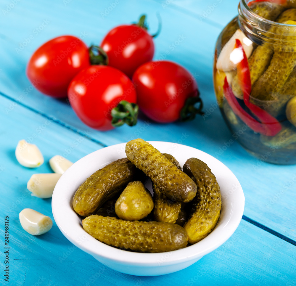 pickled cucumbers and tomatoes in bowl on white background pickled cucumbers and tomatoes in bowl on white background