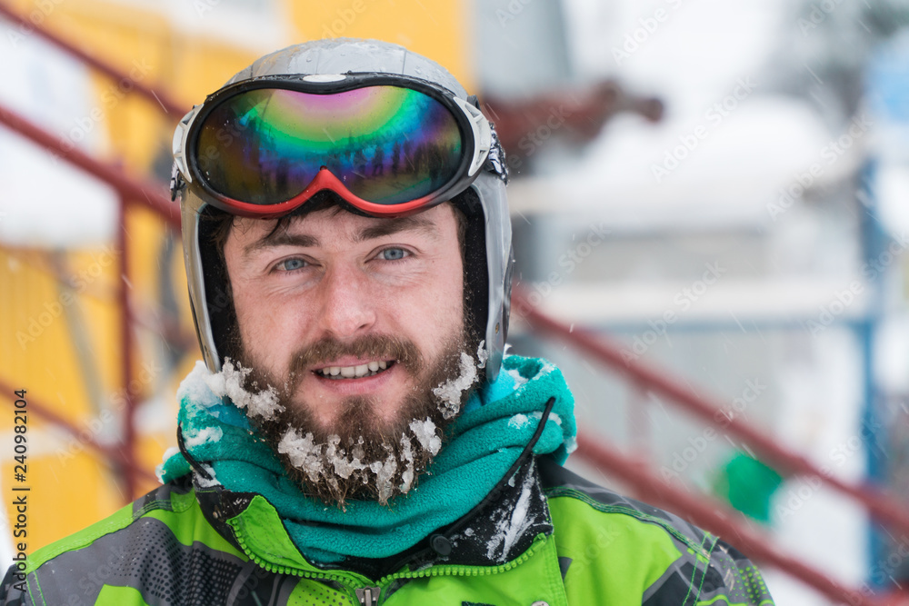 skier in the mask on the face of a snow man and snow skis. skier in the mask on the face of a snow man and snow skis.