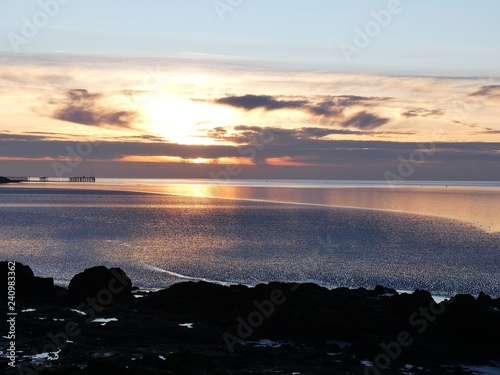 Beautiful sunset across Half Moon Bay, Heysham, Lancashire photo