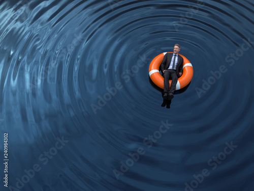 Canvas Print businessman floating on the lifebuoy