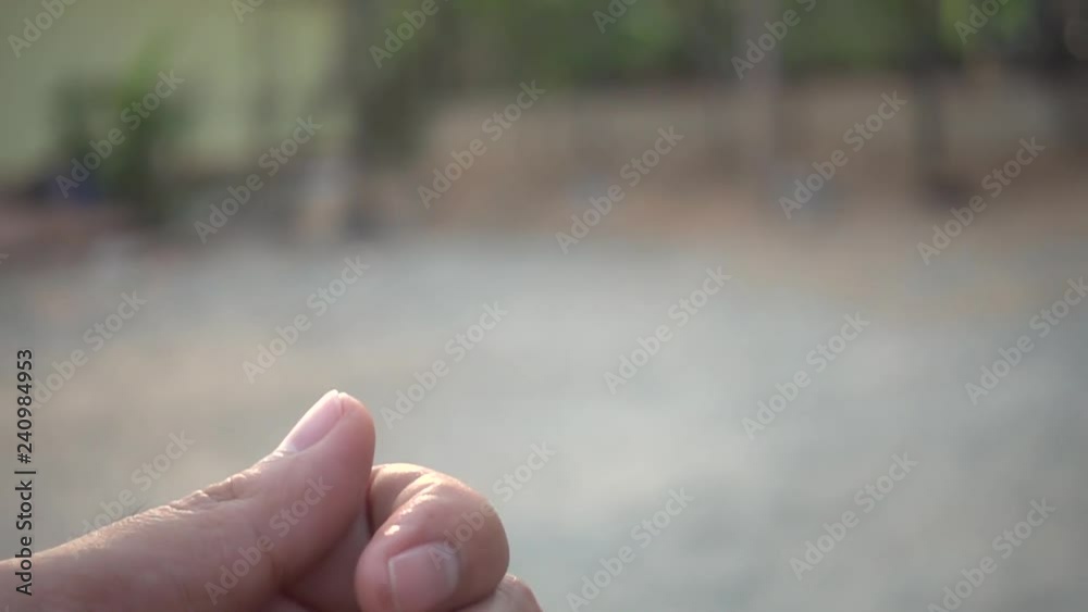 Man tossing a coin in slow motion Man tossing a coin in slow motion