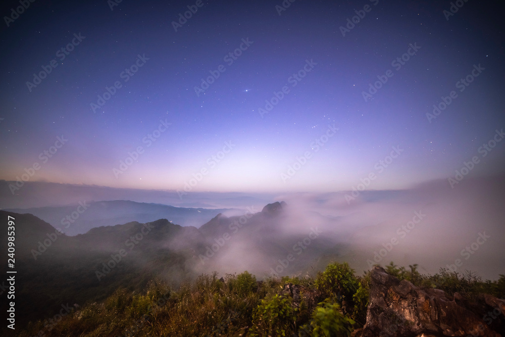 Stars on the top of a mountain covered with fog
