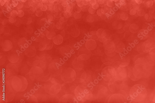 Delicate glitter bokeh Coral background. Creative and moody color of the picture.