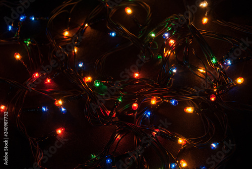 Glowing Christmas garland on a black background