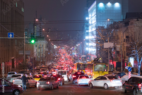Traffic jam in the night city. Traffic jam is seen on the second ring road in city downtown. City traffic night blurred