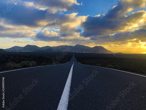 Endless road at sunset in the countryside of Lanzarote