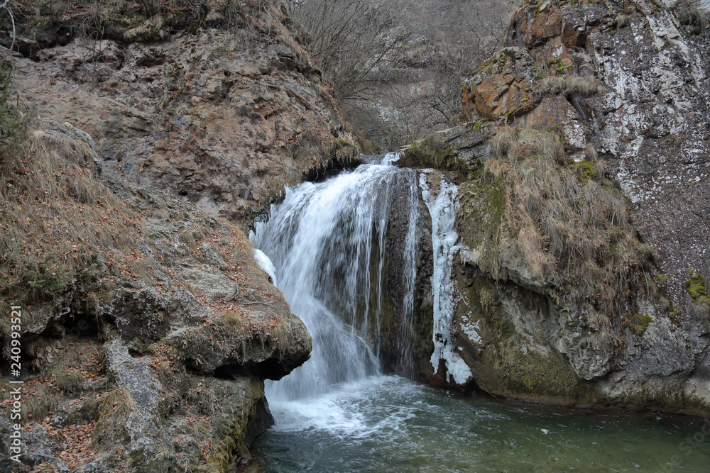 Scenic Honey Waterfalls in a snowless winter. Karachay-Cherkessia, Russia