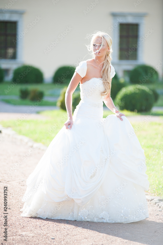 Beautiful sensual bride blonde in wedding dress 