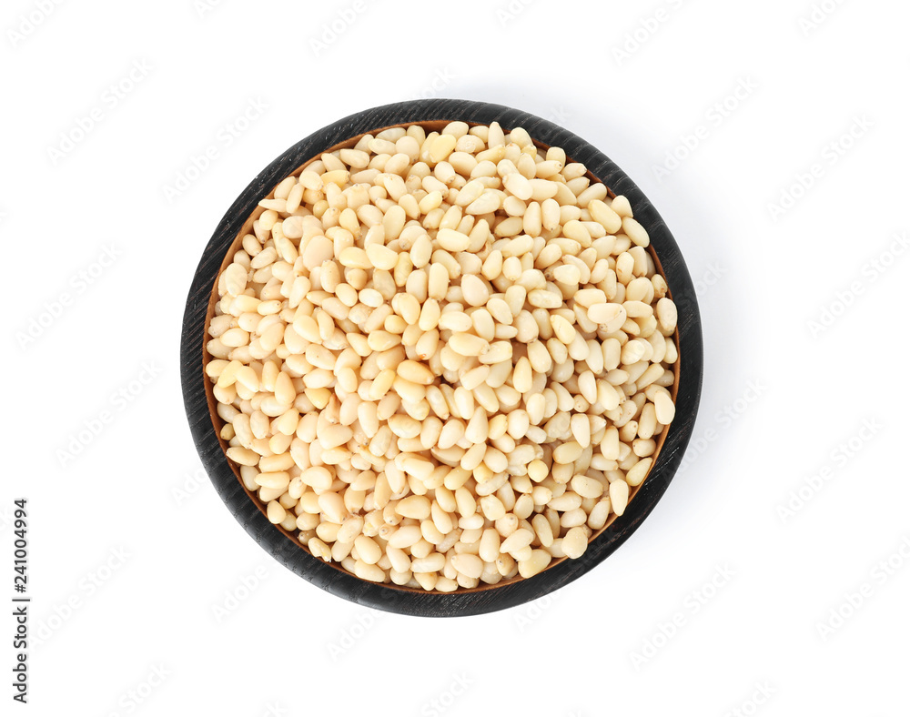 Plate with pine nuts on white background, top view Plate with pine nuts on white background, top view