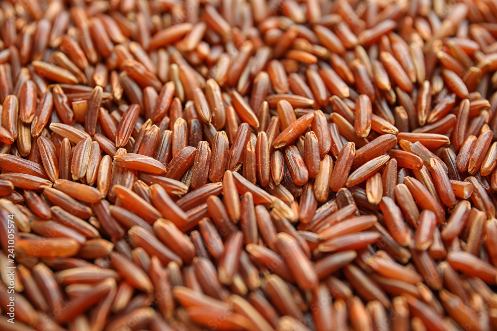 Pile of uncooked red rice as background, closeup Pile of uncooked red rice as background, closeup