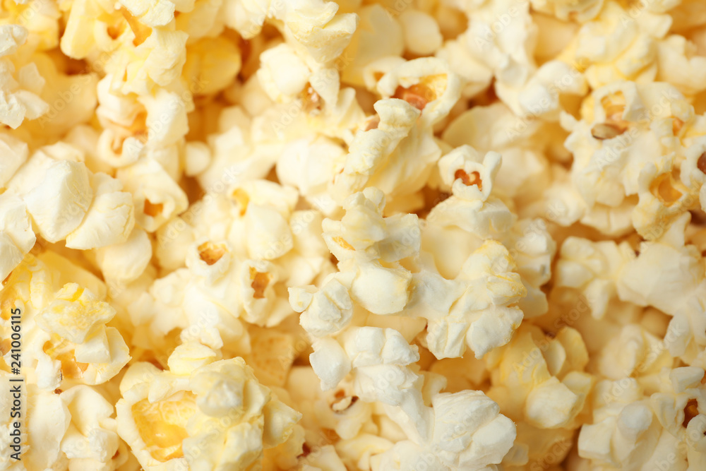 Fresh popcorn as background, closeup. Tasty snack