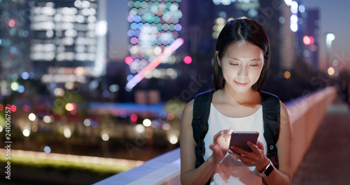 Woman use of mobile phone at night © leungchopan