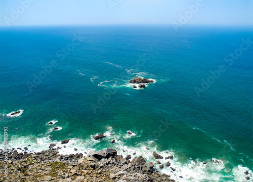 Atlantic ocean and cliffs, bright sunny days, turquoise waves.