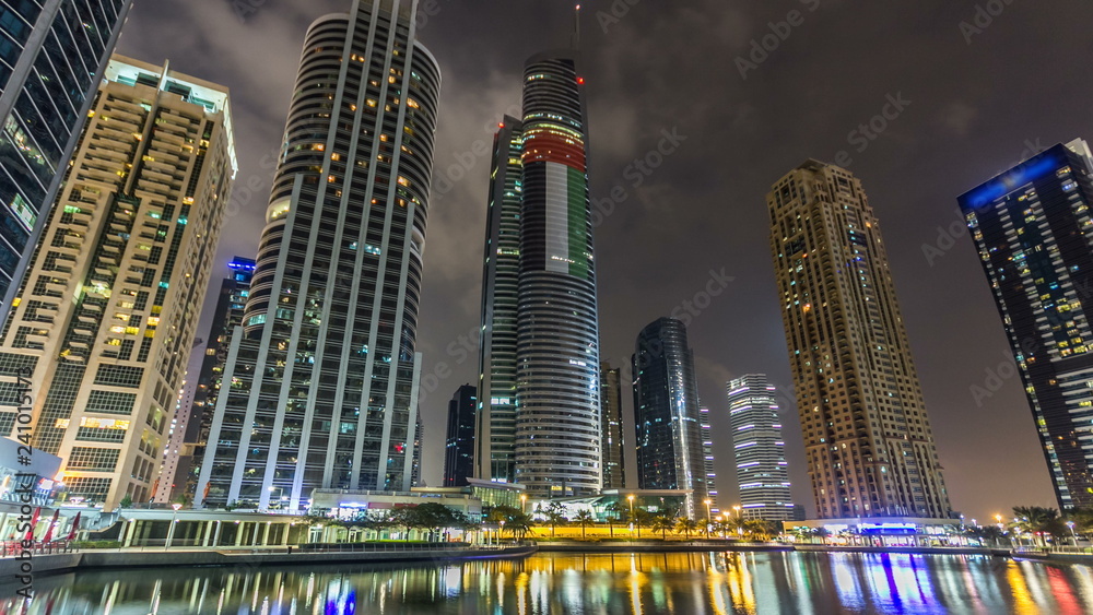 Fototapeta premium Residential buildings in Jumeirah Lake Towers timelapse hyperlapse in Dubai, UAE.