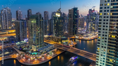 Beautiful aerial top view day to night timelapse of Dubai Marina in Dubai, UAE