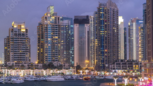 View of Dubai Marina Towers and canal in Dubai day to night timelapse
