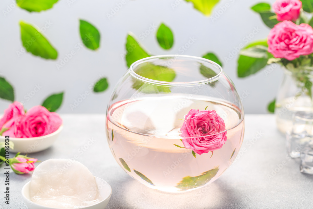 Facial lotion extract with rose petals. Cotton pads. Healing homemade skincare moisture tonic. Facial lotion extract with rose petals. Cotton pads. Healing homemade skincare moisture tonic.