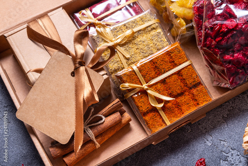 Blocks of homemade chocolates with dried berries, gift wrapped
