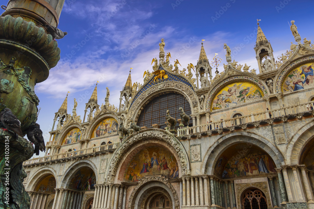 The Patriarchal Cathedral Basilica of Saint Mark at the Piazza San Marco - St Mark's Square, Venice Italy. The exterior of the west facade of Saint Mark's Basilica (Basilica di San Marco).