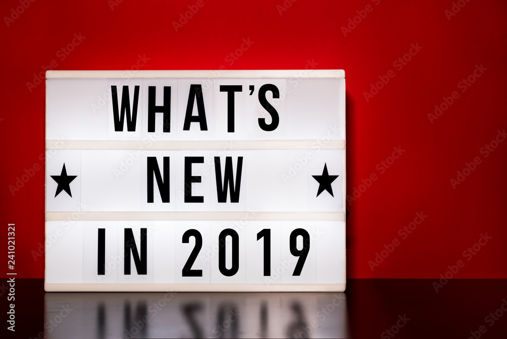 What's new in 2019 sign - cinema style lettering on light box & warm red background What's new in 2019 sign - cinema style lettering on light box & warm red background