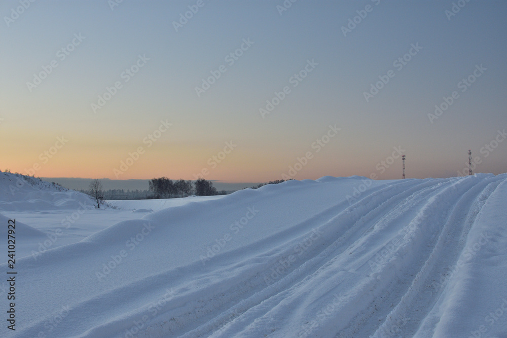 winter landscape with road and blue sky