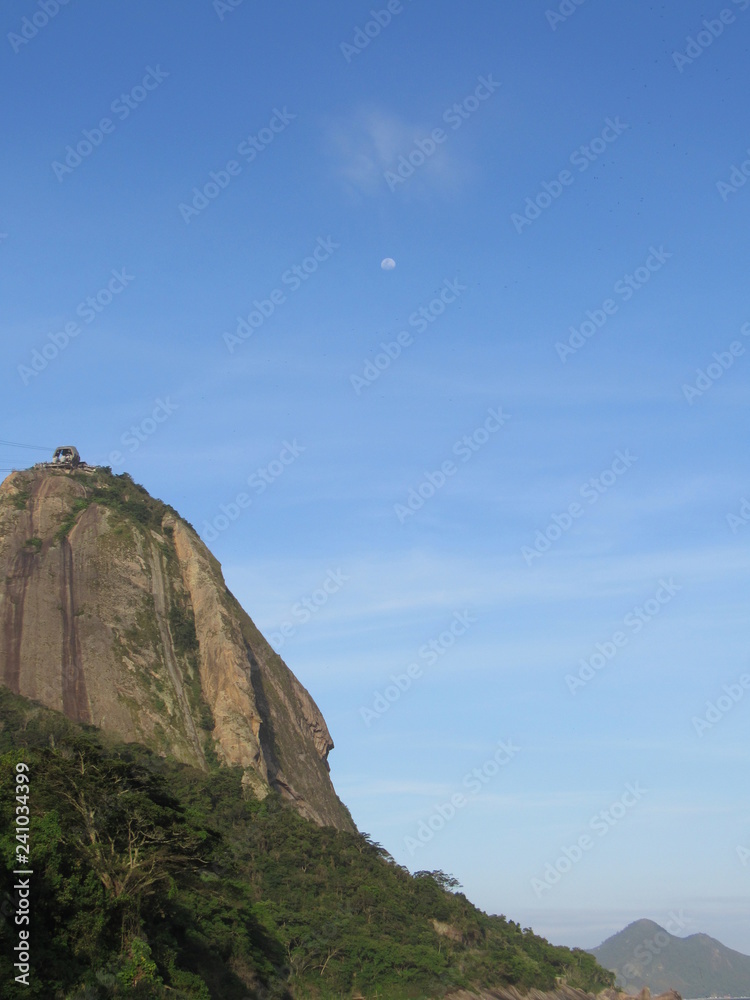 Sugarloaf Mountain, moon  and blue sky