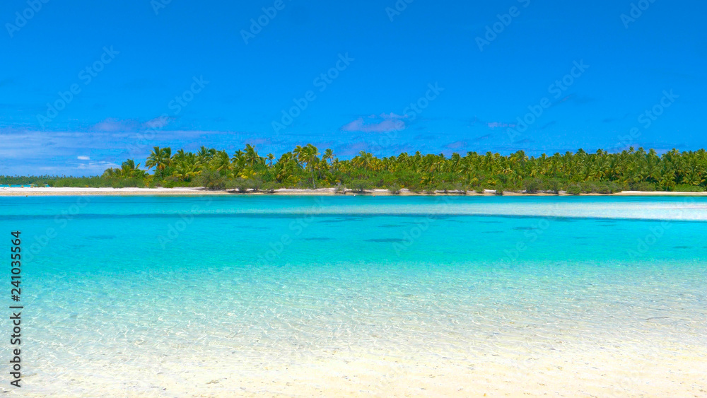 COPY SPACE: Crystal clear ocean water by tropical island glimmers in summer sun.