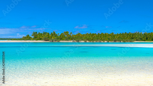 COPY SPACE: Crystal clear ocean water by tropical island glimmers in summer sun. © helivideo