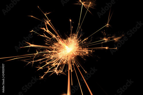 Bengal fire fireworks on black background / sparkling fireworks on black macro background