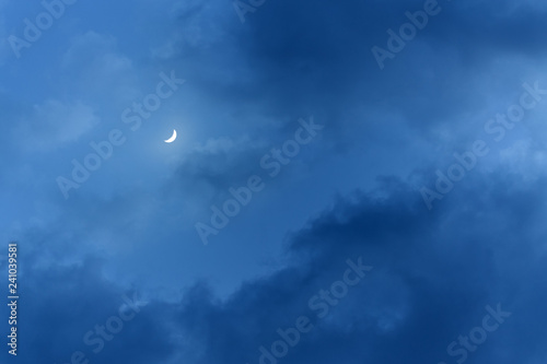 little moon in the big clouds / night cloud landscape the light of the moon