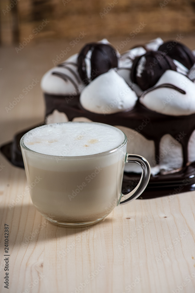 Coffee and cake on a wooden table. Coffee and cake on a wooden table.