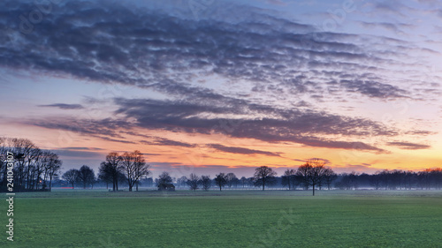Rural scenery with a colorful daybreak, Weelde, Belgium.
