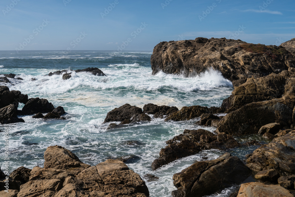 Scenic ocean view of Point Lobos State Reserve in California, near Monterey along the Pacific Coast Highway, as waves crash into the shoreline
