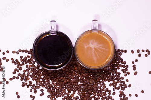 Aerial view of coffee cups with creama nd black with coffee beans photo