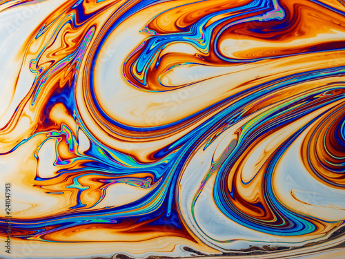 Colourful psychedelic soap bubble refractions pattern macro. photo