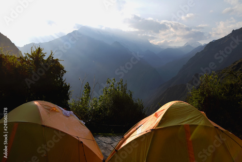 Camping in mountains. Photo taken of tents during sunrise in the mountains in Peru.