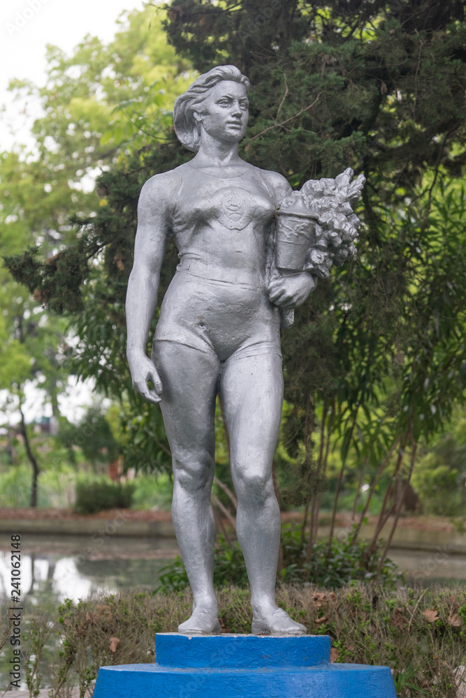 Sculpture of the Soviet period on the background of nature.