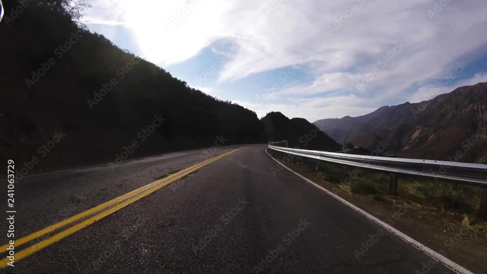 high speed descent down curving mountain road high speed descent down curving mountain road