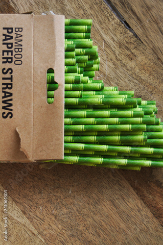 Bamboo paper straws in an open cardboard packet.